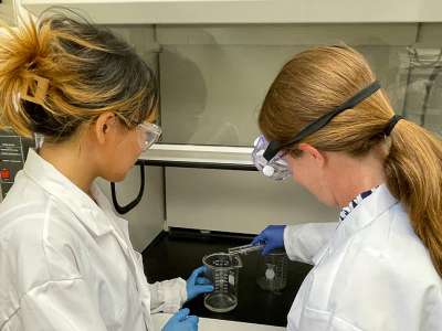 Two students working in lab