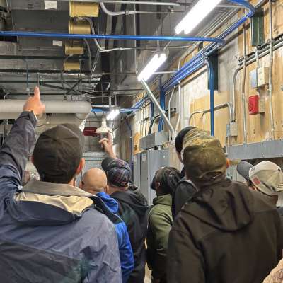 Continuing Education students touring a warehouse.